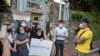 Two groups of protesters confront each other in Washington, DC, over different views on Thai politics, leading to a heated conversation in front of the Royal Thai Embassy. 