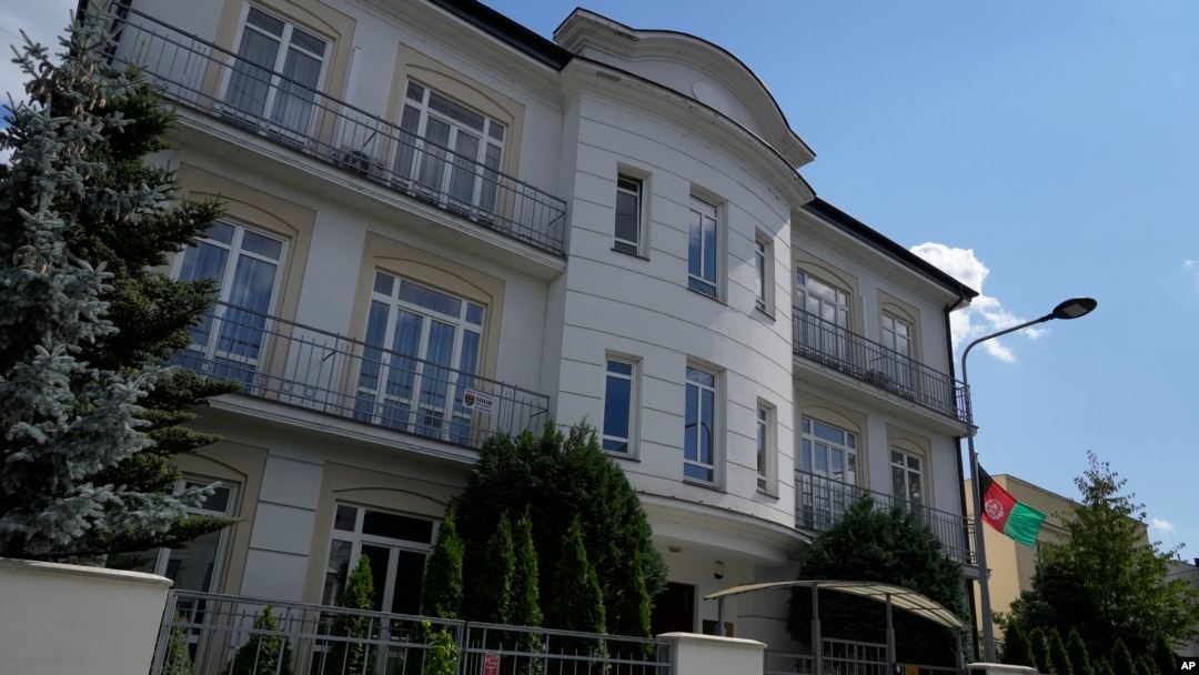 A flag hangs outside the Afghan Embassy in Warsaw, Poland, on July 30, 2024. While the Taliban has disavowed many Afghan diplomatic missions, Afghan diplomats say they will continue to provide consular services.