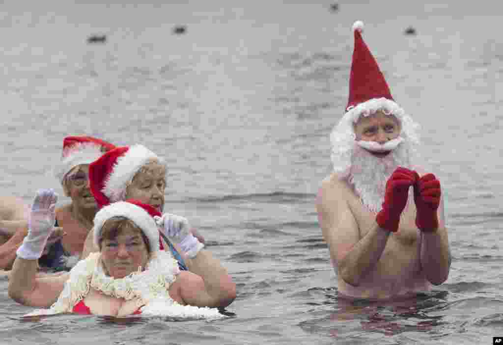 Members of the swimming club 'Berlin Seals' go for a dip in Orankesee Lake in Berlin, Germany.