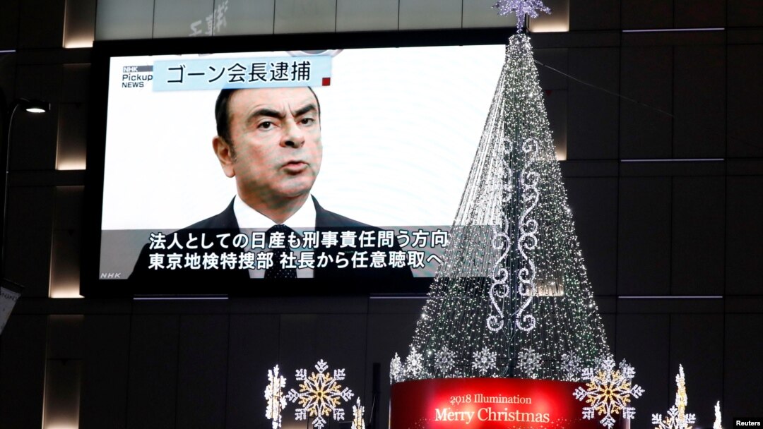 A street monitor showing a news report about arrest of Nissan Chairman Carlos Ghosn is seen in Tokyo, Japan, Nov. 21, 2018.