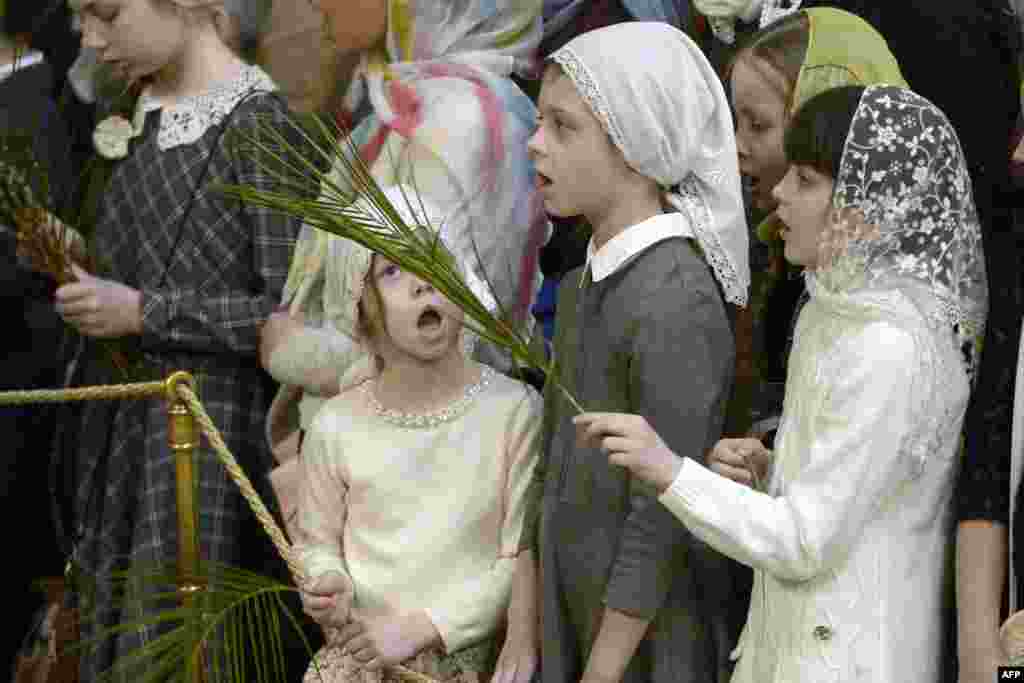 Russian Orthodox believers attend a Palm Sunday service at Saint Petersburg's Saint Isaac's Cathedral.