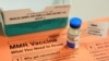 FILE - A vial of measles, mumps and rubella vaccine and an information sheet is seen at Boston Children's Hospital in Boston.