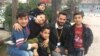 Boys in Reyhanli, Turkey pose for a picture, saying they are often afraid of rockets hitting their homes in Turkey, after they fled Syria for safety on Feb. 4, 2018. 
