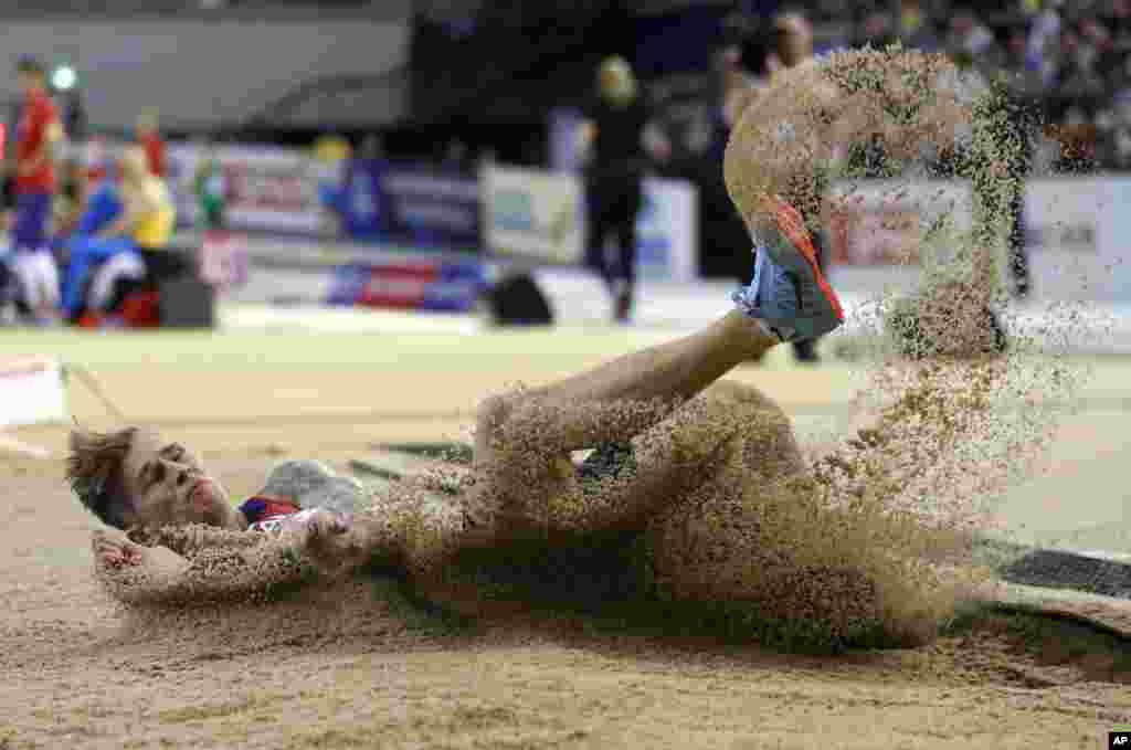 Radek Juska of the Czech Republic makes an attempt in the men's long jump qualifying at the European Athletics Indoor Championships at the Emirates Arena in Glasgow, Scotland.