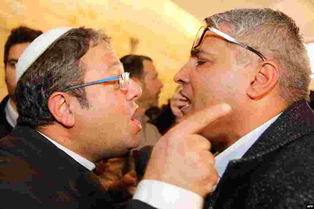 Jewish Power party's Itamar Ben Gvir (L) argues with the Israeli-Arab candidate Ata Abu Medeghem of Raam-Balad after a hearing at the Israeli Supreme Court in Jerusalem.