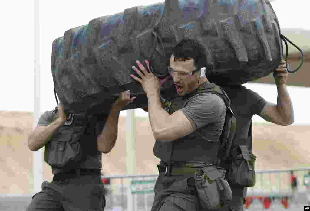 EKO Cobra, a police tactical unit from Austria, competes during the UAE SWAT Challenge, organized by the United Arab Emirates interior ministry in Dubai, UAE.