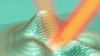 This illustration shows a 3-D skin cloak made from an ultrathin layer of gold blocks covering an irregularly shaped object. Light reflects off the cloak as if it were reflecting off a flat mirror. (UC Berkeley)