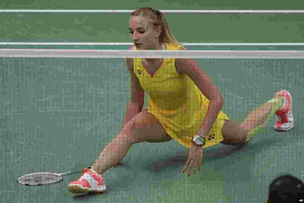 Hungary's Laura Sarosi fails to return a shot to Canada's Michelle Li during a Women's single match at the 2016 Summer Olympics in Rio de Janeiro, Brazil, Aug. 13, 2016.