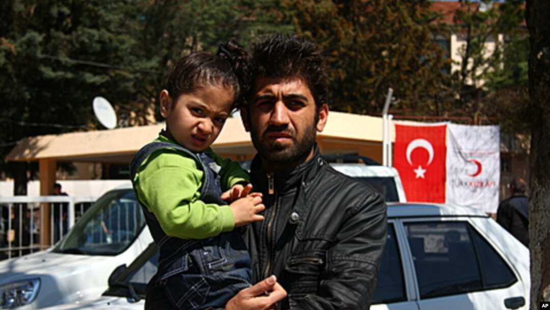 Ciwan, who would only give his first name because he has family still in Syria, escaped with his son from his hometown Idlib, Yayladagi, Turkey, March 22 , 2012.