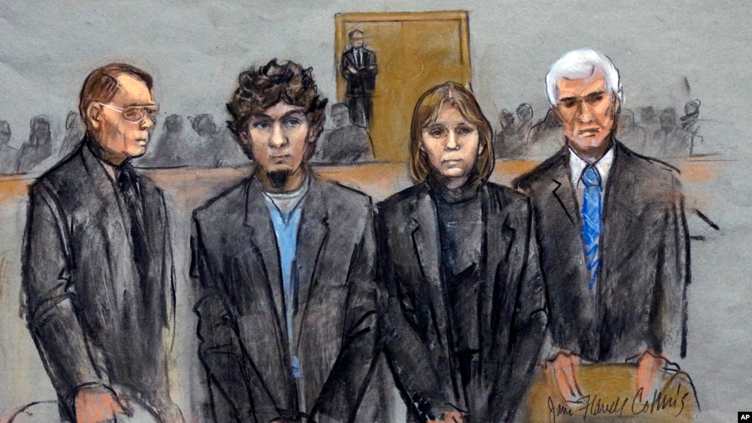 In this courtroom sketch, Dzhokhar Tsarnaev (2nd from Left) is depicted standing with his defense attorneys William Fick (L) Judy Clarke (2nd from R), and David Bruck (R) as the jury presents its verdict in his federal death penalty trial, April 8, 2015, 