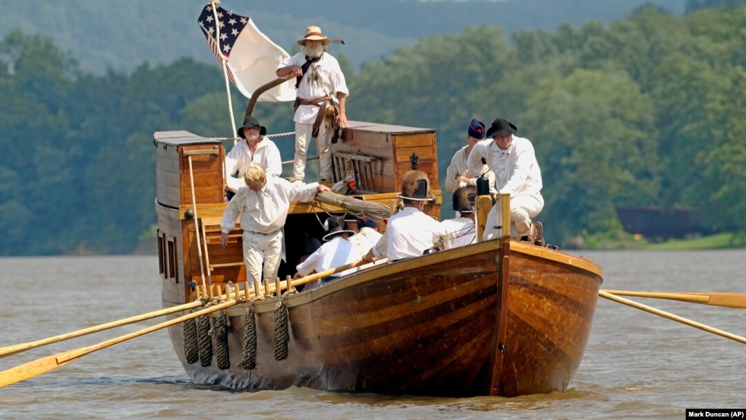 Re-enactors of the Corps of Discovery retrace the steps of Lewis and Clark. (AP Photo/Mark Duncan)