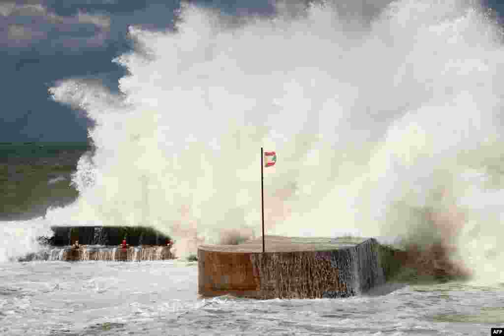Waves crash on the shoreline of the al-Manara promenade in Lebanon's capital city Beirut.
