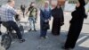 Local residents inspect an impact crater at the site of an Israeli drone strike that killed three Palestinians, on the day of their funeral at Jenin refugee camp in the Israeli-occupied West Bank Oct. 25, 2023. 