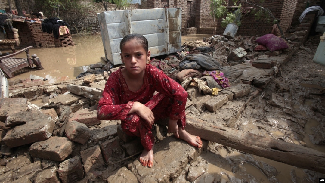 A Pakistani girl in what is left of her house in Nowshera, near Peshawar, Pakistan, Aug. 22, 2012. 