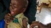 A child reacts as he receives an injection during the nationwide vaccination campaign against measles, rubella and polio targeting all children younger than 15 in Nkozi town, about 84 km from the capital Kampala, Uganda, Oct. 19, 2019.