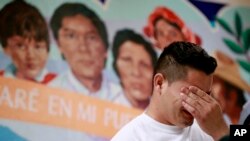 FILE - Christian, from Honduras, recounts his separation from his child at the border during a news conference at the Annunciation House,in El Paso, Texas, June 25, 2018.