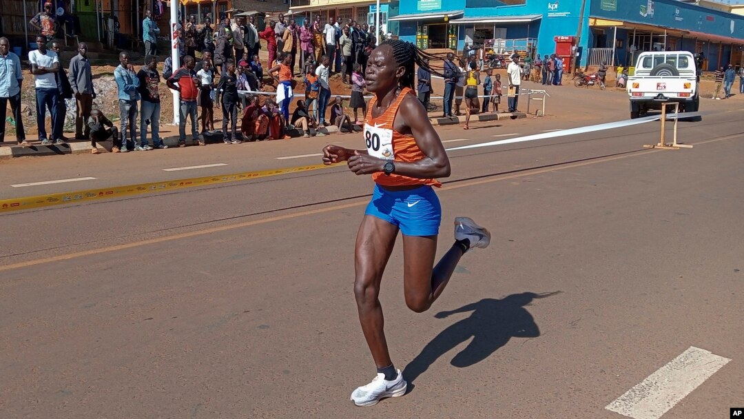FILE - Rebecca Cheptegei competes at a 10 km road race in Kapchorwa, Uganda, Jan. 20, 2023.