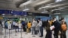 Foreign tourists arrive at Suvarnabhumi Airport during the first day of the country's reopening campaign, part of the government's plan to jump start the pandemic-hit tourism sector in Bangkok, Thailand November 1, 2021. REUTERS/Chalinee Thirasupa