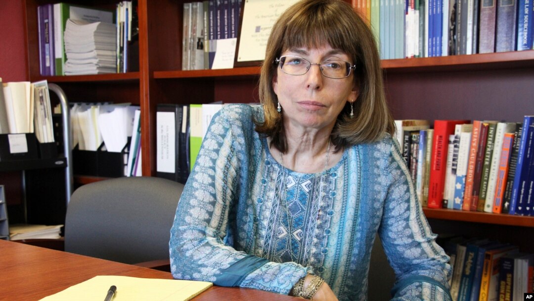 Margaret Stock, an Alaska-based immigration attorney and a retired Army Reserve lieutenant colonel who helped create the immigrant recruitment program, poses at her office in Anchorage, Alaska, July 3, 2018. Stock said she's been inundated over the past s