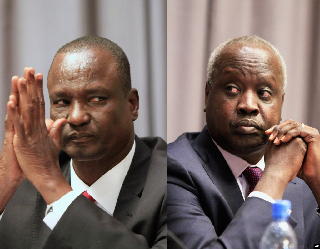Taban Deng Gai, left, head of the rebel delegation and South Sudan's leader of the government delegation, Nhial Deng Nhial, attend the opening ceremony of South Sudan's peace negotiations, Addis Ababa, Ethiopia, January 4, 2014.