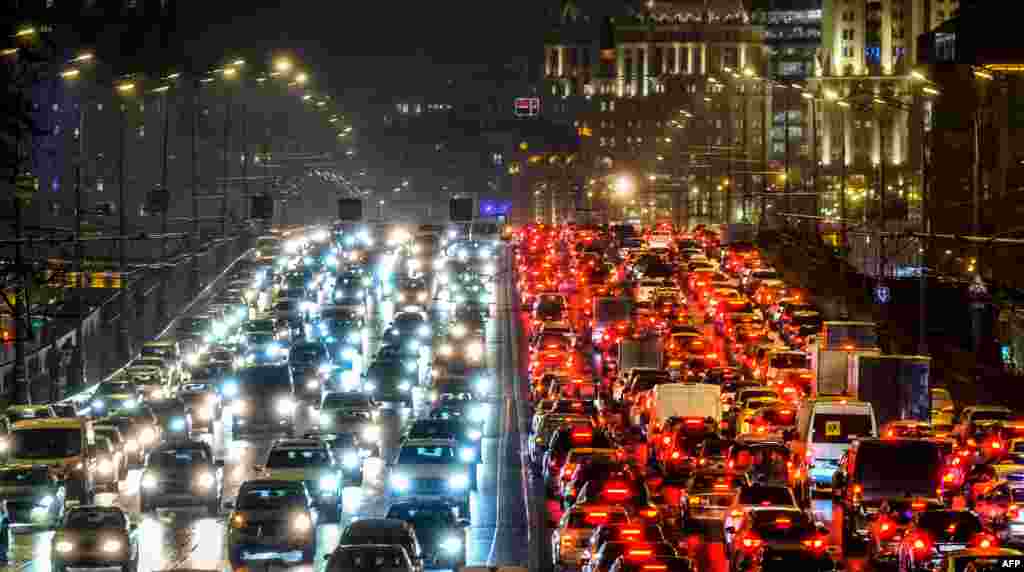 Cars move slowly along a bridge amid a traffic jam in Moscow, Russia.