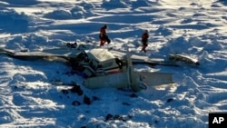 This photo provided by the U.S. Coast Guard on Feb. 7, 2025, shows a small commuter plane that crashed in western Alaska on a flight that was bound for the hub community of Nome. 